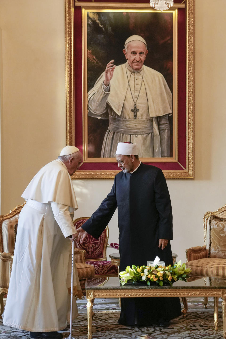 Pope Francis is greeted by Ahmed El-Tayeb, Grand Imam of al-Azhar, as he arrives for a meeting with the members of the Muslim Council of Elders at the Mosque of Sakhir Royal Palace, Bahrain, Friday, Nov. 4, 2022. Pope Francis is making the November 3-6 visit to participate in a government-sponsored conference on East-West dialogue and to minister to Bahrain's tiny Catholic community, part of his effort to pursue dialogue with the Muslim world. (AP Photo/Alessandra Tarantino)