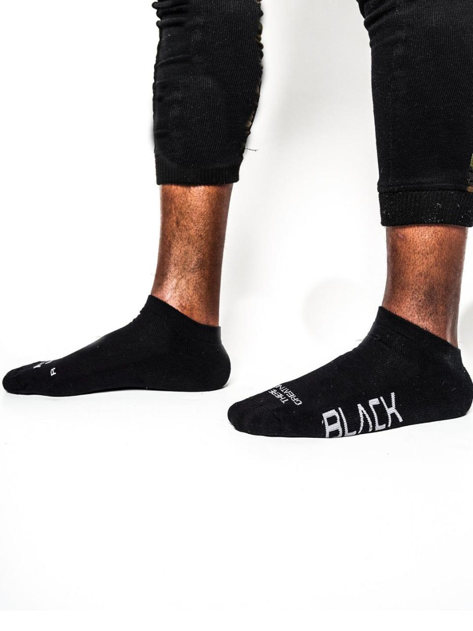 <p><strong>Actively Black</strong></p><p>activelyblack.com</p><p><strong>$15.00</strong></p><p><a href="https://activelyblack.com/products/actively-black-low-cut-performance-socks" rel="nofollow noopener" target="_blank" data-ylk="slk:Shop Now;elm:context_link;itc:0;sec:content-canvas" class="link ">Shop Now</a></p><p>If you want to feel ready to conquer <em>anything</em> after you put your socks on, you need these, which feature a bit of inspirational wisdom printed on 'em: "There is greatness in your DNA." Plus, they feature a slightly compressed fit that's perfect for HIIT workouts.</p>