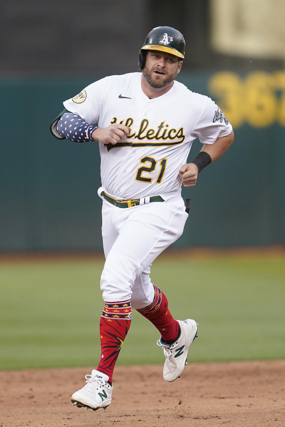 FILE - Oakland Athletics' Stephen Vogt rounds the bases after hitting a home run during the sixth inning of a baseball game against the Toronto Blue Jays in Oakland, Calif., Monday, July 4, 2022. Vogt is retiring after 10 major league seasons and a long, patient road to break into the big leagues at age 27. (AP Photo/Jeff Chiu, File)