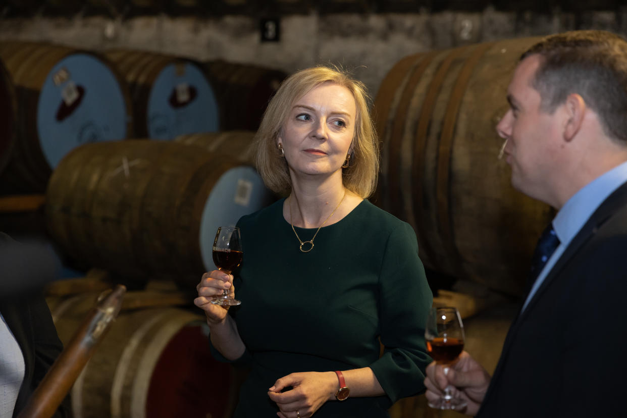 ELGIN, SCOTLAND - AUGUST 16: Conservative Leadership hopeful Liz Truss and leader of the Scottish Conservative Party Douglas Ross visit the BenRiach Distillery on August 16, 2022 in Elgin, Scotland. Liz Truss was accompanied by Douglas Ross, leader of the Scottish Conservatives along with Laura Tolmie of BenRiach. Foreign Secretary, Liz Truss and former Chancellor Rishi Sunak are vying to become the new leader of the Conservative Party and the UK's next Prime Minister. (Photo by Paul Campbell - Pool/Getty Images)