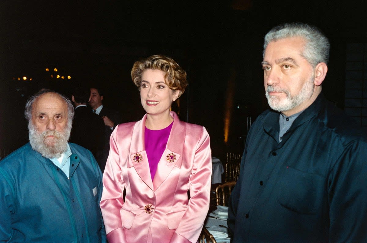 French sculptor Cesar, French actress Catherine Deneuve and Spanish designer Paco Rabanne attend an Aids gala event,  Paris in 1991 (AFP via Getty Images)