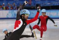 Charles Hamelin of Canada celebrates his victory in the men's 1,500 metres short track speed skating finals event at the Iceberg Skating Palace during the 2014 Sochi Winter Olympics February 10, 2014. REUTERS/David Gray (RUSSIA - Tags: SPORT SPEED SKATING OLYMPICS TPX IMAGES OF THE DAY)