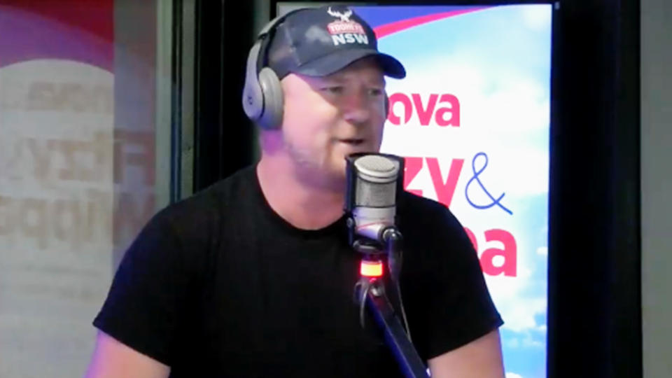 MAFS star Dean Wells speaking into a microphone in the Nova 96.9 radio studios