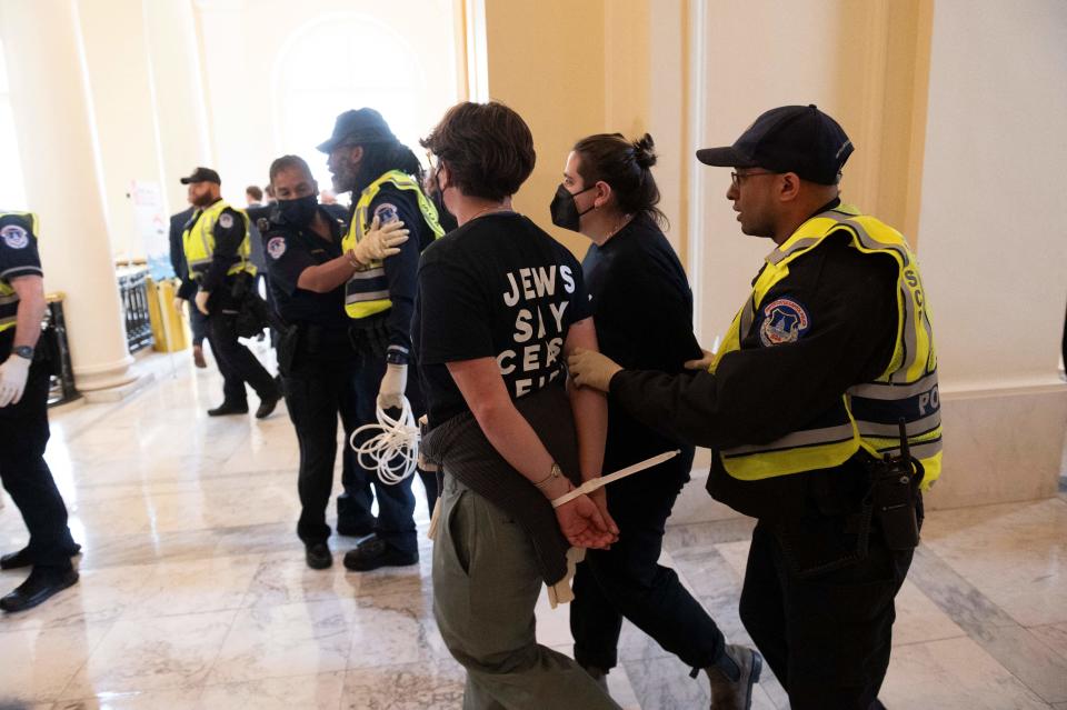 Protesters with the group Jewish Voice for Peace are arrested after a sit-in against the Israeli military operation in Gaza inside the Cannon House Office Building on Capitol Hill in Washington, D.C., Oct. 18, 2023.  / Credit: ROBERTO SCHMIDT/AFP via Getty Images
