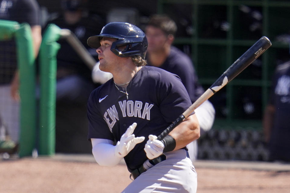 New York Yankees' Luke Voit drives in a run with a single off Philadelphia Phillies starting pitcher Aaron Nola during the third inning of a spring training baseball game in Clearwater, Fla., Thursday, March 11, 2021. (AP Photo/Gene J. Puskar)