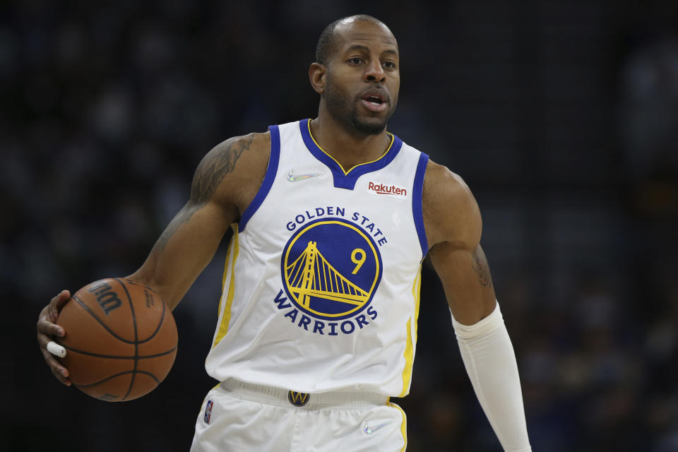 FILE - Golden State Warriors forward Andre Iguodala handles the ball during the second half of an NBA basketball game against the Minnesota Timberwolves, Jan. 16, 2022, in Minneapolis. Iguodala, a four-time champion with the Golden State Warriors during a 19-year NBA career, is retiring. “It’s just the right time,” the 39-year-old Iguodala told Andscape in a telephone interview Friday, Oct. 20, 2023. (AP Photo/Stacy Bengs, File)