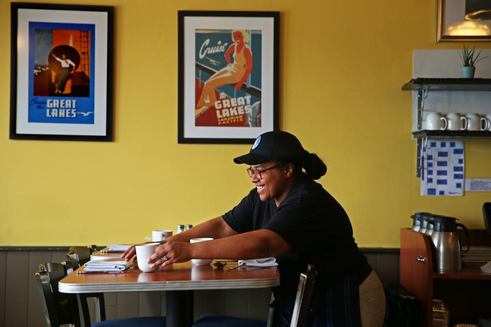 Lexi Ellis sets a table at Blue’s Egg, a breakfast and lunch restaurant, at 317 N. 76th St. The restaurant is operated by Black Shoe Hospitality, which will have five businesses represented at Indulge Milwaukee,