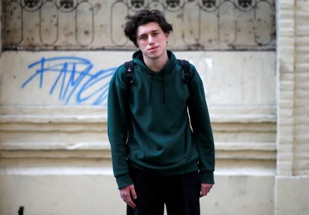 Pablo, 16, who voted for the first time in the primary elections, poses in Buenos Aires