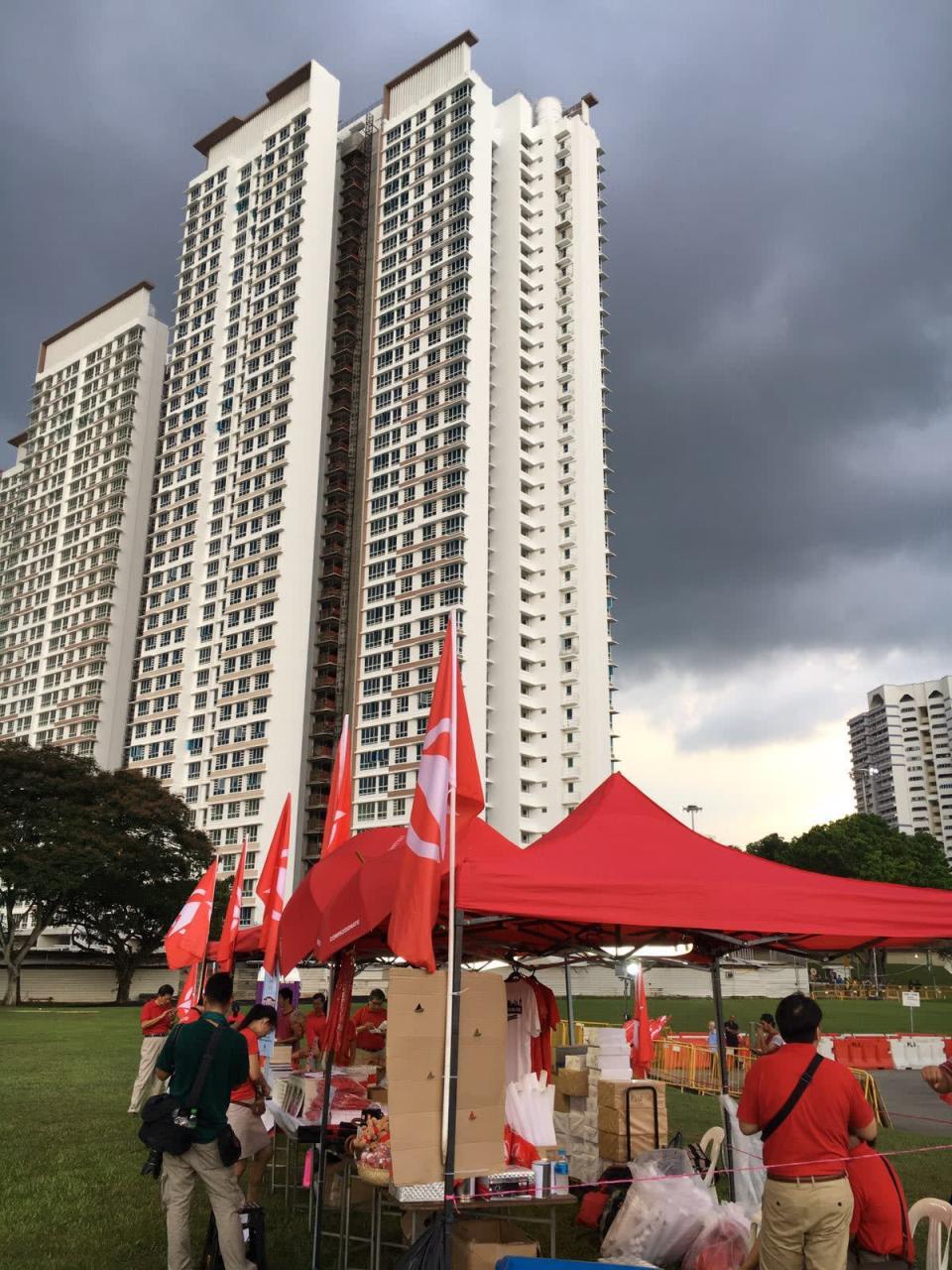 SDP volunteers set up the merchandise tent ahead of the by-election rally on 3 May. (Photo: Nicholas Yong)