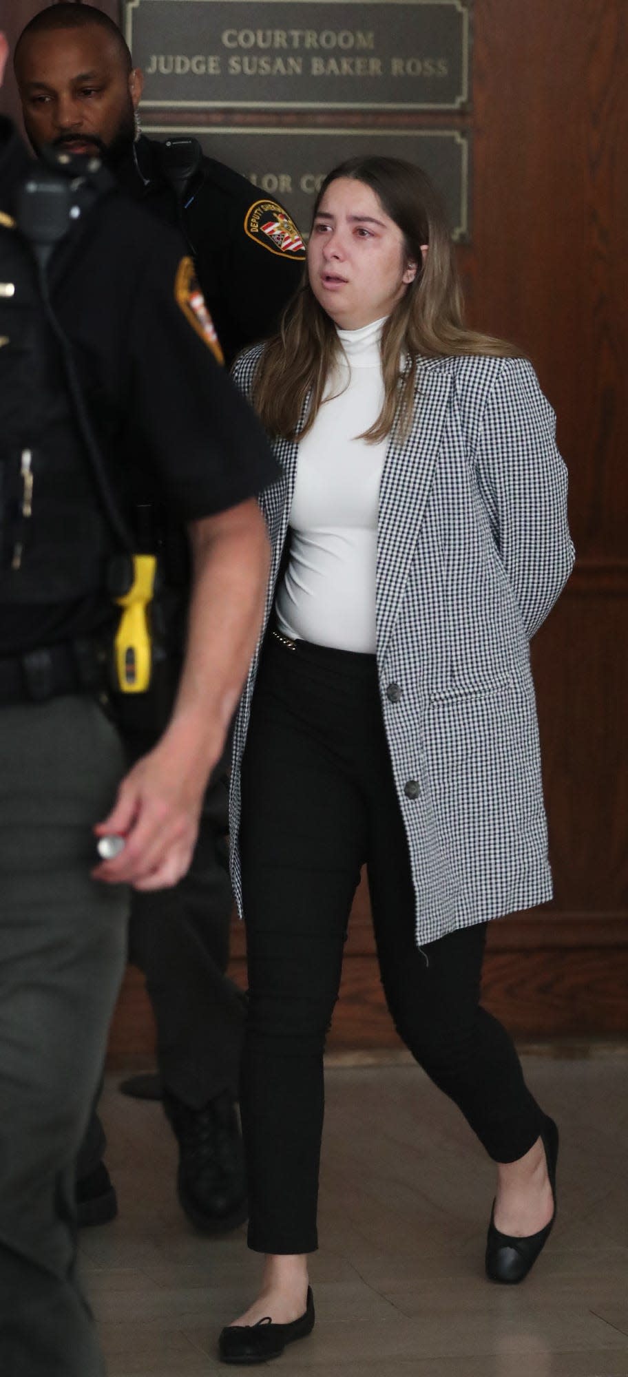 Summit County Sheriff Deputies lead Sydney Powell away after her trial in Summit County Common Pleas Judge Kelly McLaughlin's courtroom. Powell was found guilty for the stabbing death of her mother.