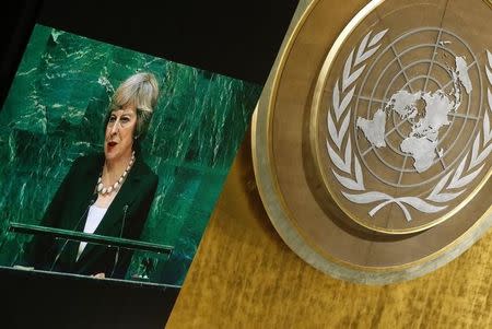 British Prime Minister Theresa May is shown on a large screen as she addresses the 71st United Nations General Assembly in Manhattan, New York, U.S. September 20, 2016. REUTERS/Carlo Allegri