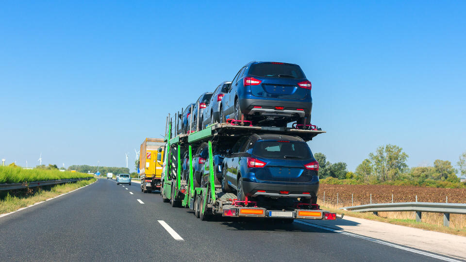 cars being transported by semi-truck