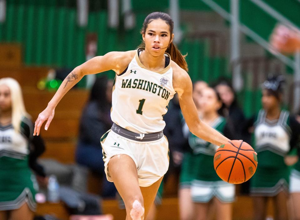 Washington's Amiyah Reynolds (1) drives down the court during the Washington vs. Fort Wayne Northrop girls basketball game Wednesday, Jan. 18, 2023 at Washington High School.