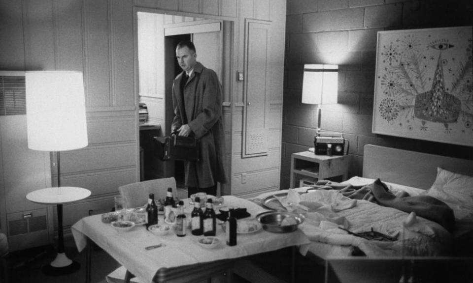 An FBI agent inspecting a room in Lake Tahoe from which Frank Sinatra Jr was kidnapped in 1963.