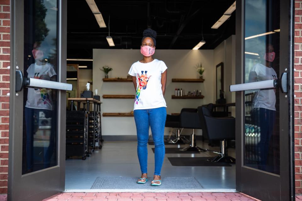 Nekita Sullivan, owner of Butterfly Eco Beauty Bar in Clemson, S.C., Aug. 14, 2020. Sullivan opened her salon in February before being forced to close down in March due to COVID-19.