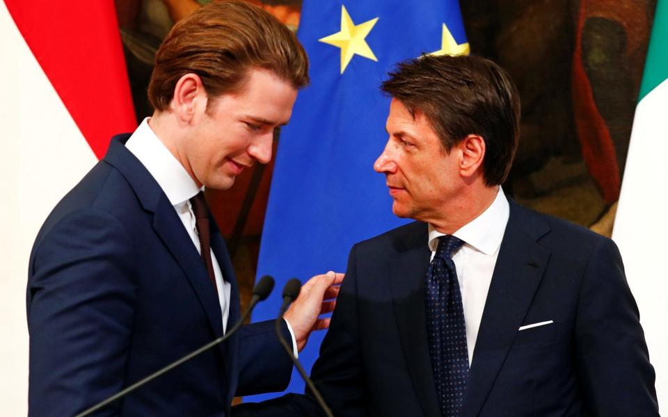 Sebastian Kurz and Italian Prime Minister Giuseppe Conte talk at the end of a news conference in Rome - REUTERS