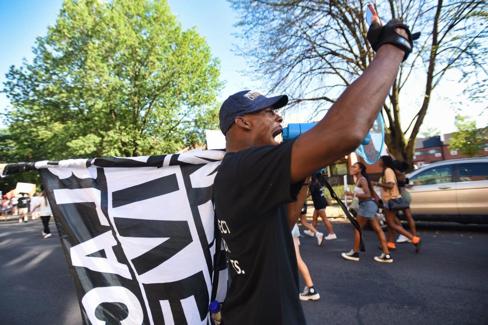 Ainsworth Minott, the leader and founder of Heal the World,  is among the protesters marching for women's rights along Englewood Avenue in Englewood on 07/03/22.