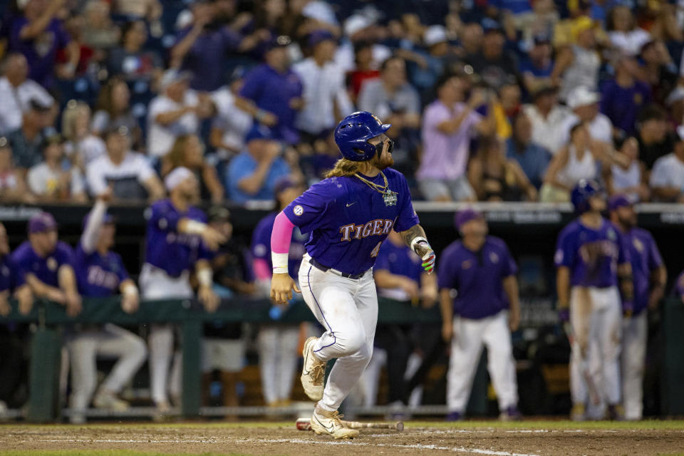 LSU's Tommy White watches his game-winning home run against Wake Forest during the 11th inning of a baseball game at the NCAA College World Series in Omaha, Neb., Thursday, June 22, 2023. (AP Photo/John Peterson)