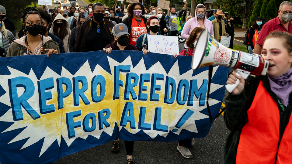 ALEXANDRIA, VA - MAY 09: Abortion-rights advocates mach in the street to stage a protest outside the house of Supreme Court Associate Justice Samuel Alito in the Fort Hunt neighborhood on Monday, May 9, 2022 in Alexandria, VA. (Kent Nishimura / Los Angeles Times via Getty Images) 