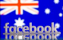 A 3D printed Facebook logo is seen in front of displayed Australia's flag in this illustration photo