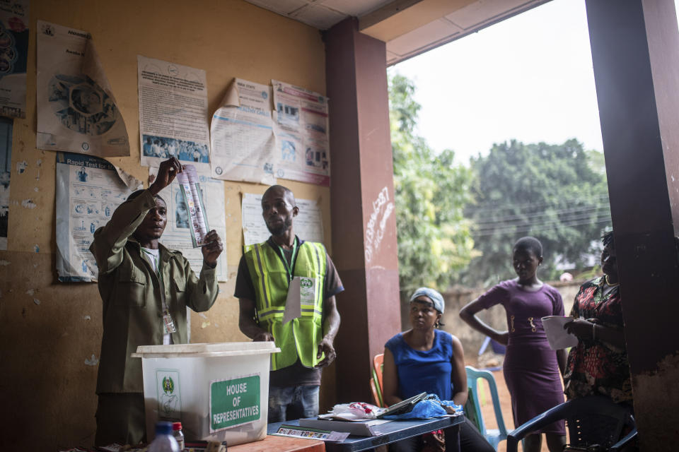 Electoral workers count the ballots at a polling station during the presidential elections in Agulu, Nigeria, Saturday, Feb. 25, 2023. Voters in Africa's most populous nation are heading to the polls Saturday to choose a new president, following the second and final term of incumbent Muhammadu Buhari. (AP Photo/Mosa'ab Elshamy)