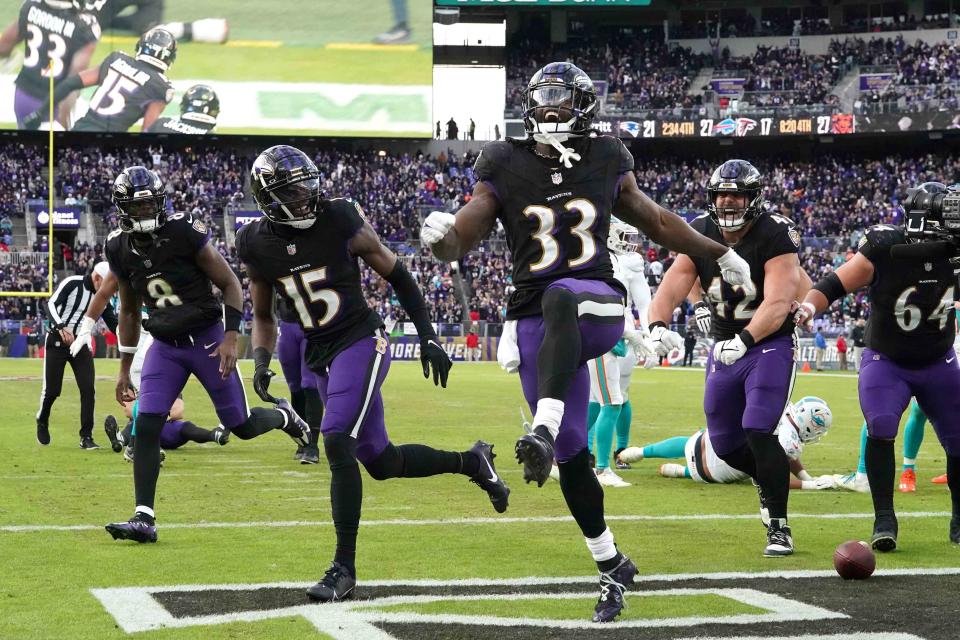 Dec 31, 2023; Baltimore, Maryland, USA; Baltimore Ravens running back Melvin Gordon III (33) reacts following his fourth quarter touchdown run against the Miami Dolphins at M&T Bank Stadium. Mandatory Credit: Mitch Stringer-USA TODAY Sports