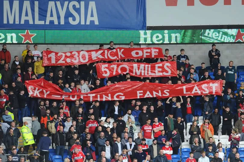 Middlesbrough fans protest with a banner after their trip to Cardiff City was moved to 12.30 pm