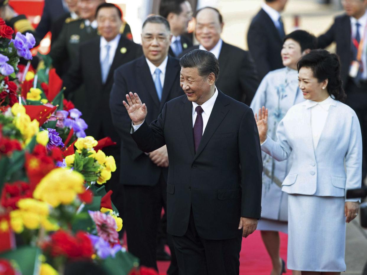 Chinese president Xi Jinping and his wife Peng Liyuan arrive at Macao airport