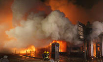 Firefighters battle flames and smoke in Tottenham on Saturday night. 