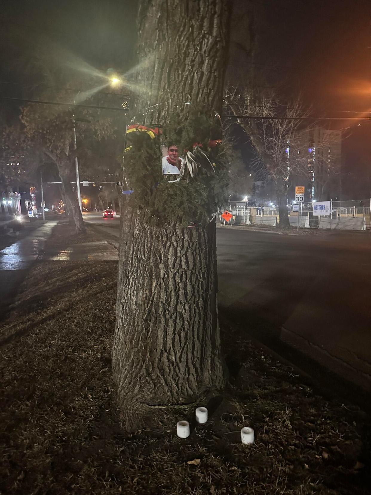 A memorial has been set up in Edmonton's Oliver neighbourhood, at the site where a man was killed Sunday in an altercation with police. (Paige Parsons/CBC - image credit)