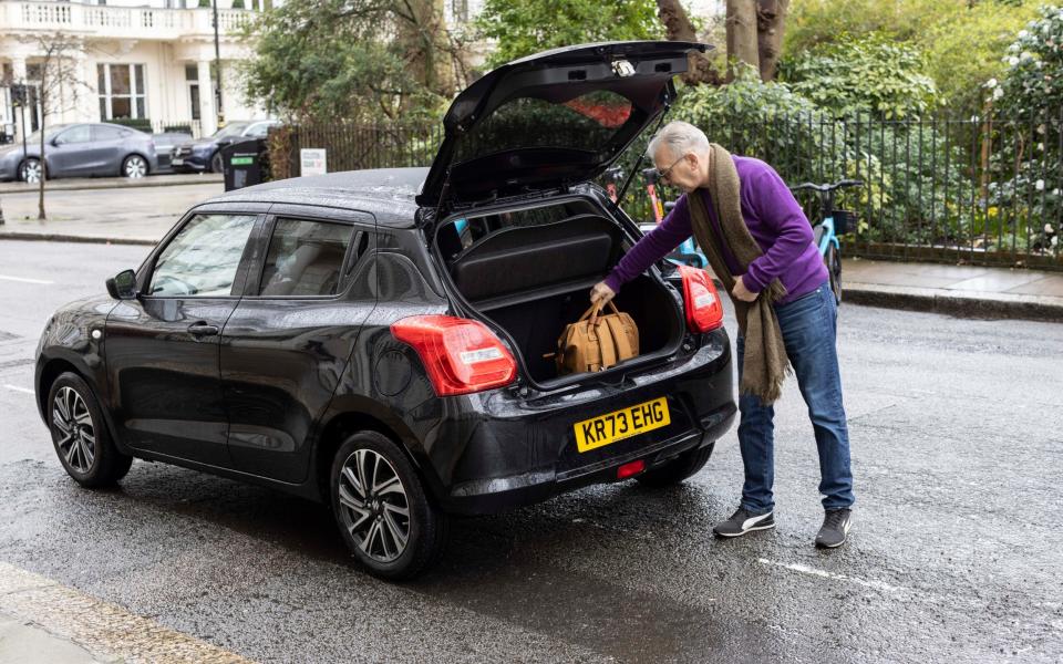 You will find opening and closing handles on each side of the latch on the tailgate