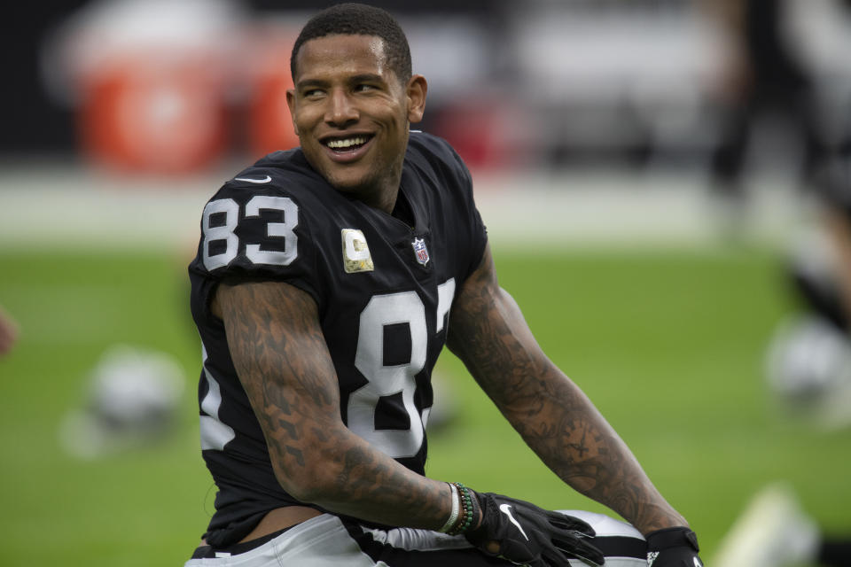 FILE - Las Vegas Raiders tight end Darren Waller (83) with his helmet off before a game against the Cincinnati Bengals during an NFL football game on Nov. 21, 2021, in Las Vegas, Nev. Waller and many of the NFL’s tight ends will gather in June, 2022, for the second Tight End University camp. (AP Photo/John McCoy, File)