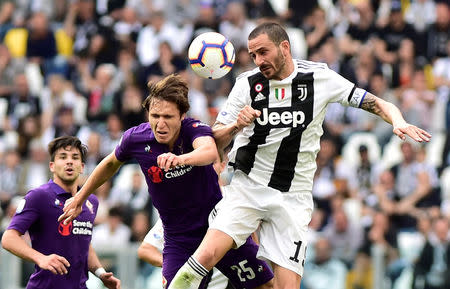 Soccer Football - Serie A - Juventus v Fiorentina - Allianz Stadium, Turin, Italy - April 20, 2019 Juventus' Leonardo Bonucci in action with Fiorentina's Federico Chiesa REUTERS/Massimo Pinca