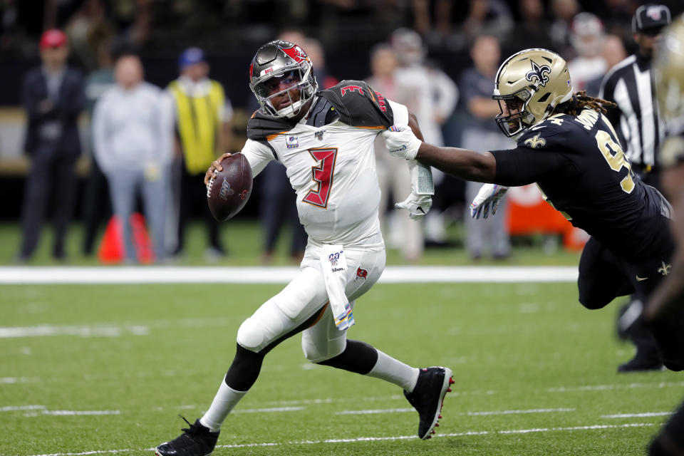 Tampa Bay Buccaneers quarterback Jameis Winston (3) scrambles under pressure from New Orleans Saints defensive end Cameron Jordan in the first half of an NFL football game in New Orleans, Sunday, Oct. 6, 2019. (AP Photo/Bill Feig)