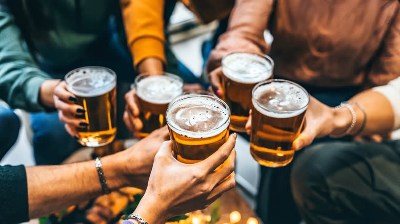 friends toasting with beer