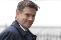 The head of the British Intelligence Service (MI6) John Sawers smiles at the media as he arrives for the Nelson Mandela memorial service at Westminster Abbey in London, Monday, March 3, 2014. Mandela, the former president of South Africa, died in December 2013. (AP Photo/Alastair Grant)