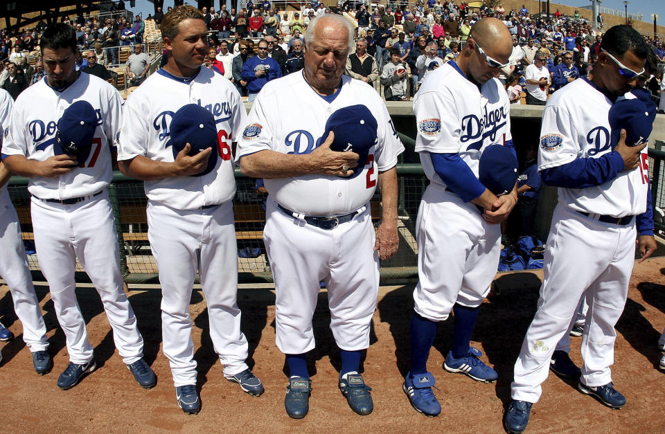 Hall of Fame and former Los Angeles Dodgers manager Tommy Lasorda passed away at the age of 93. Los Angeles Dodgers former manager Tommy Lasorda during a moment of silence for former Dodger Willie Davis who passed away Tuesday before a game at the Ballpark at Camelback Ranch on Wednesday, March 10, 2010, in Glendale,Arizona. (Keith Birmingham/The Orange County Register via AP)