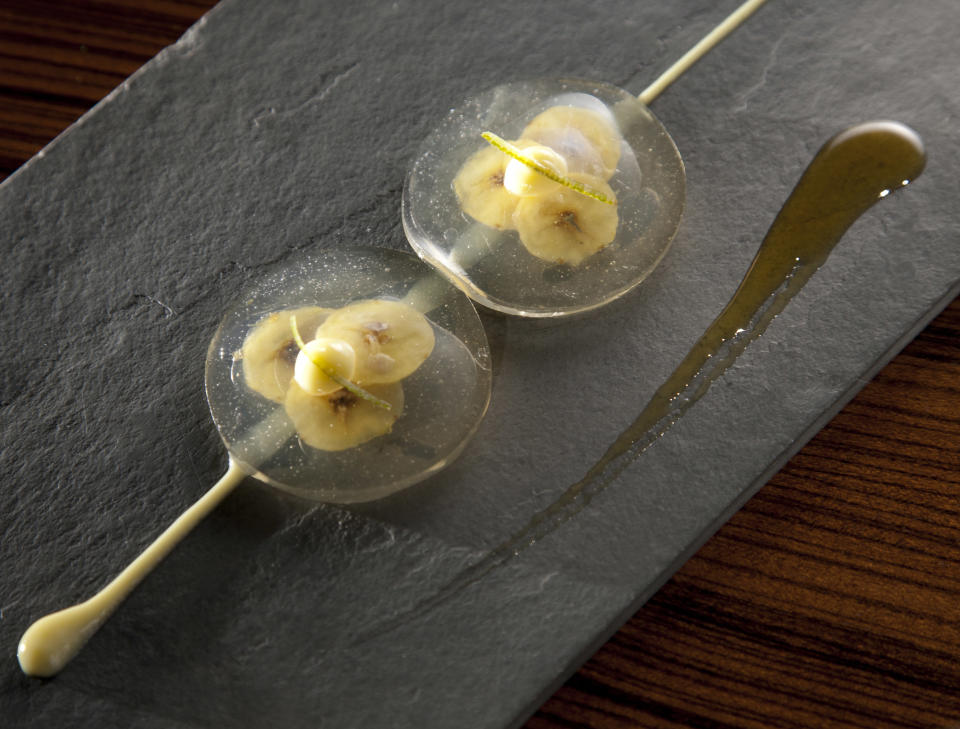 This 2011 photo released by Lotus PR shows banana, lime and priprioca caramel ravioli in Brazil. Enter "D.O.M.: Rediscovering Brazilian Ingredients," a new cookbook that chef Alex Atala hopes will propel Brazilian food onto the world's culinary stage. The book is chock-full of strange, surprising and downright bizarre ingredients, from the Brazilian sea snail, which Atala says are tastier and less fatty than their North American cousin, to the "priprioca," an aromatic herb that’s described as tasting like a cross between vanilla and earth, to "tucupi," a pickling agent that’s made from fermented manioc root juice. (AP Photo/Cassio Vasconcellos, Lotus PR)