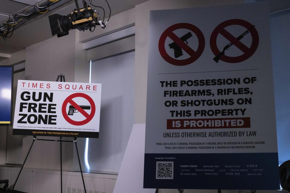 “Gun Free Zone" signs, which are expected to be installed at Times Square, are seen during a news conference, Wednesday, Aug. 31, 2022, in New York. (AP Photo/Yuki Iwamura)