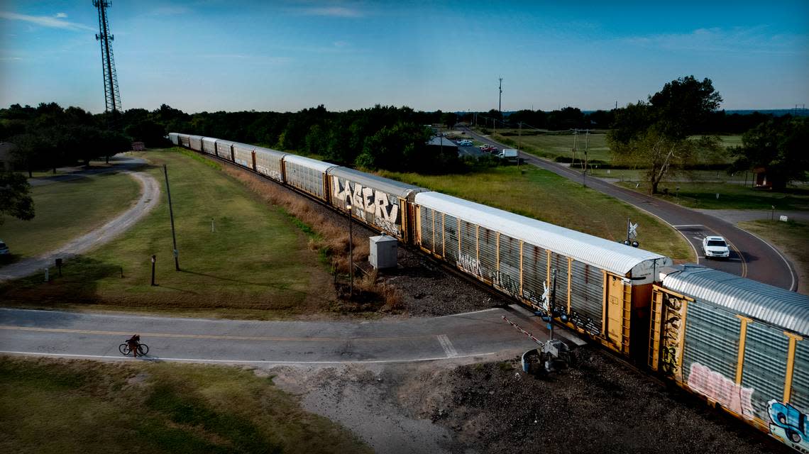 A BNSF train rolls through the Maple Street crossing in Noble, Oklahoma. In 2020, Noble resident Gene Byrd had suffered a heart attack when first responders had to wait at the crossing due to a train that was stopped there.