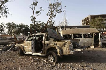 Destroyed vehicles are seen after fighting between Libyan special forces and ex-rebel fighters of the Benghazi Shura Council in the eastern city of Benghazi July 30, 2014. REUTERS/Stringer