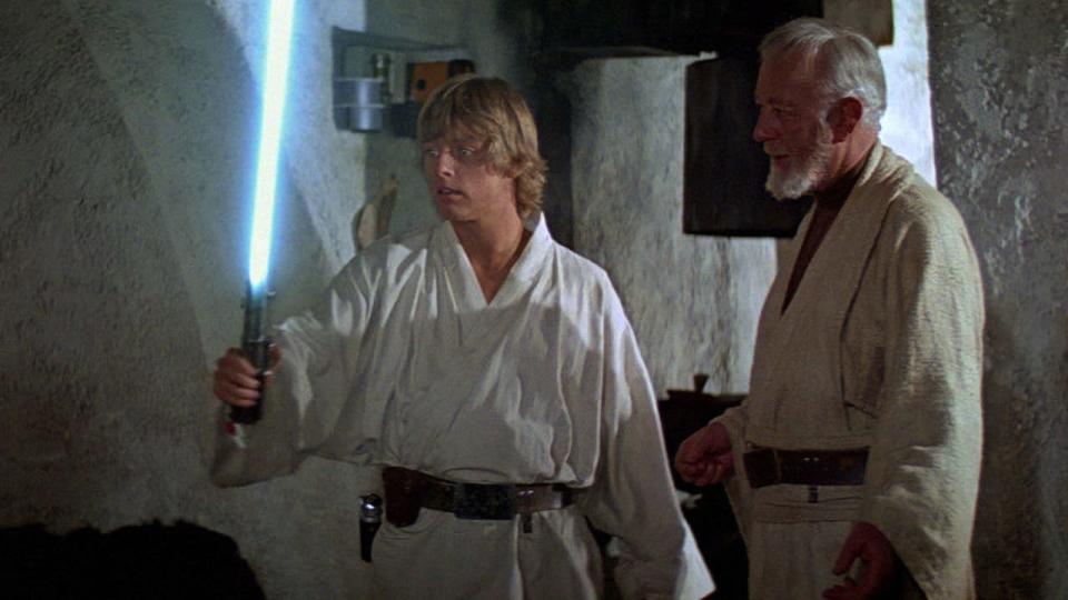 Luke Skywalker ignites a lightsaber for the first time in Obi-Wan Kenobi's hut in Tatooine's Dune Sea.