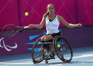 Jiske Griffioen of the Netherlands plays a return to Sabine Ellerbrock of Germany during the women's singles wheelchair tennis bronze medal match at the 2012 Paralympics games, Thursday, Sept. 6, 2012, in London. Griffioen won the match and takes the bronze medal. (AP Photo/Raissa Ioussouf)