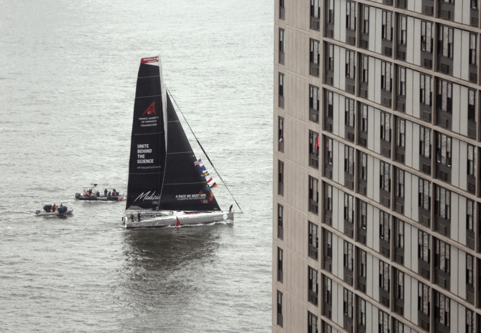 Escorted by a couple of Zodiacs, the Malizia II climate makes its way to the shores of New York City with teenaged climate activist Greta Thunberg aboard to the conclude Thunberg's trans-Atlantic voyage, Wednesday, Aug. 28, 2019. The 16-year old Thunberg crossed the Atlantic aboard the zero-emissions sailboat to address the United Nations Climate Action Summit on Sept. 23. (AP Photo/Peter Morgan)