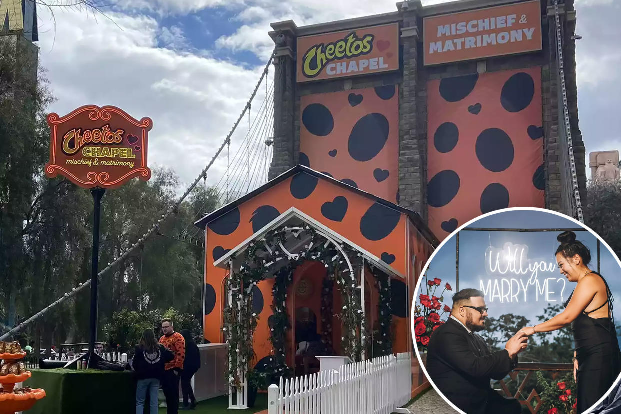 A couple stands inside the Cheetos Chapel in Las Vegas, surrounded by orange decor and a Cheetos-themed altar.