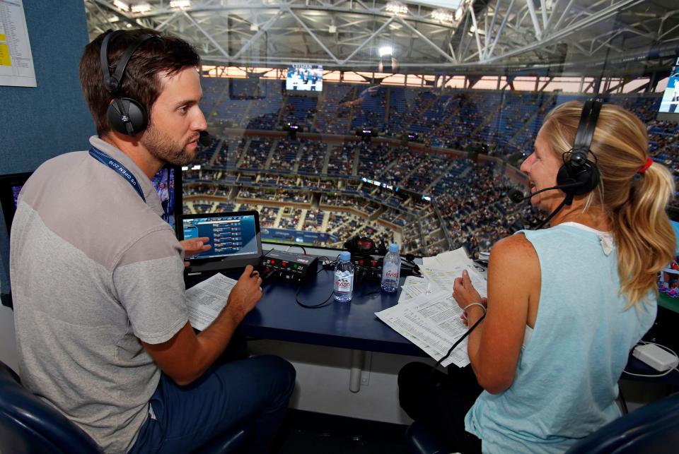 Brian Clark, left, and Jill Craybas talk during the 2016 U.S. Open in New York. Craybas says she got into broadcasting nearly by accident, but "I loved it right away."
