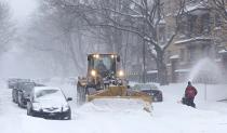 A snowplow clears the street during a snowstorm in Quebec City, December 15, 2013. Between 15 and 30cm of snow are expected to fall on the different regions of eastern Canada today, according to Environment Canada. REUTERS/Mathieu Belanger (CANADA - Tags: ENVIRONMENT SOCIETY)