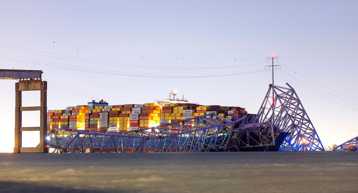 The Dali container ship underneath part of the Francis Scott Key Bridge in Baltimore, Maryland, after it collapsed. (Shutterstock)