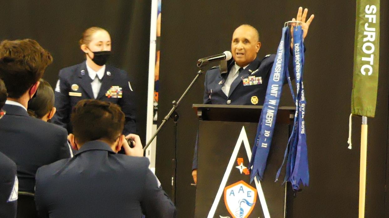 Academy for Academic Excellence Senior Space Science Instructor Ret. Colonel George Armstrong III shows off award streamers earned by his Air Force ROTC cadets, many who are now part of the new Space Force Junior ROTC Program at the school in Apple Valley.