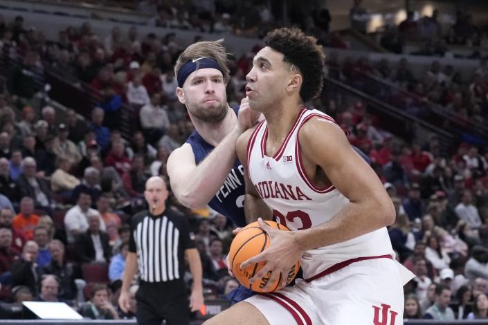 Indiana's Trayce Jackson-Davis (23) goes to the basket against Penn State's Michael Henn (24) during the second half of an NCAA semifinal basketball game at the Big Ten men's tournament, Saturday, March 11, 2023, in Chicago. (AP Photo/Charles Rex Arbogast)